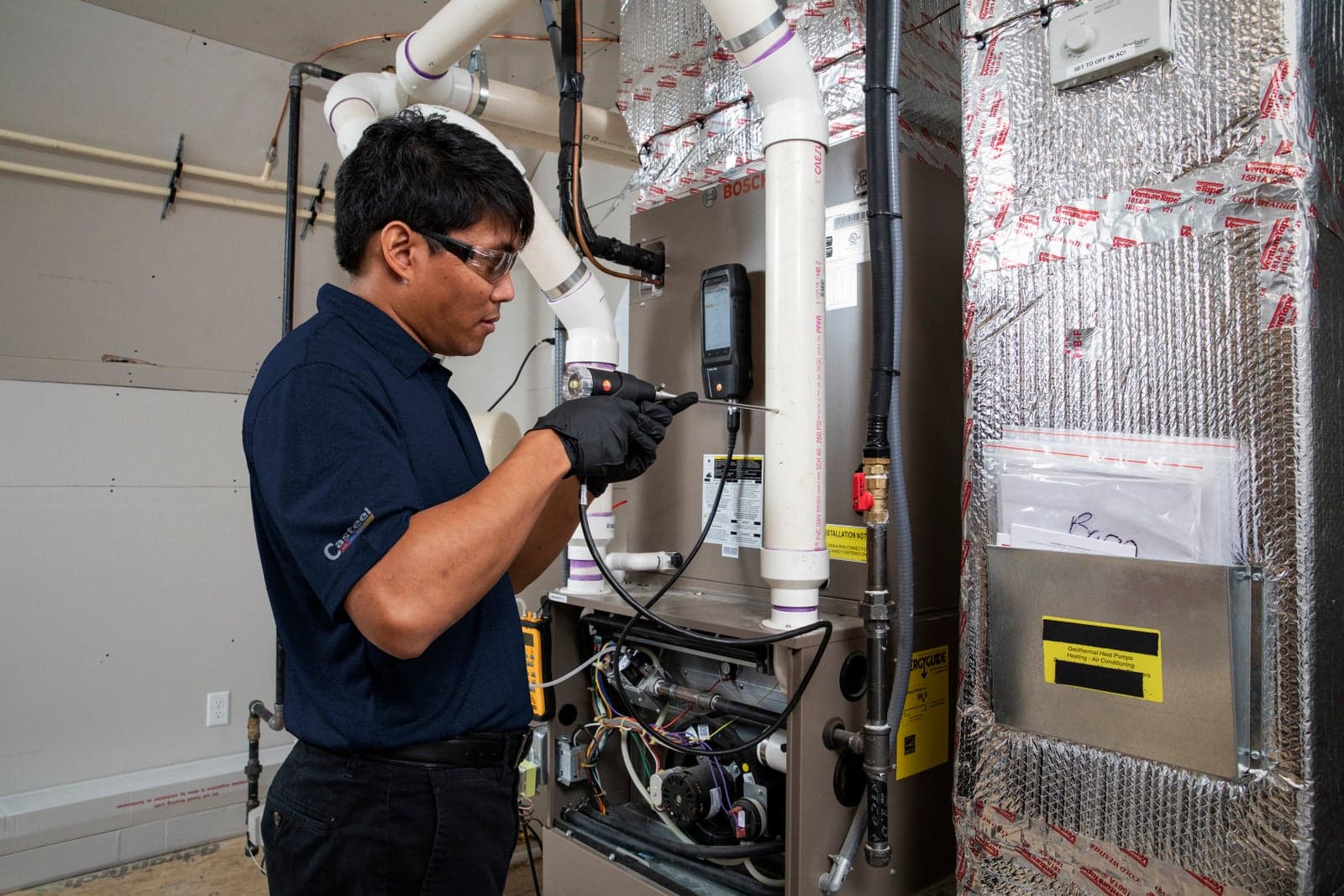 A Casteel technician diagnosing a short-cycling furnace
