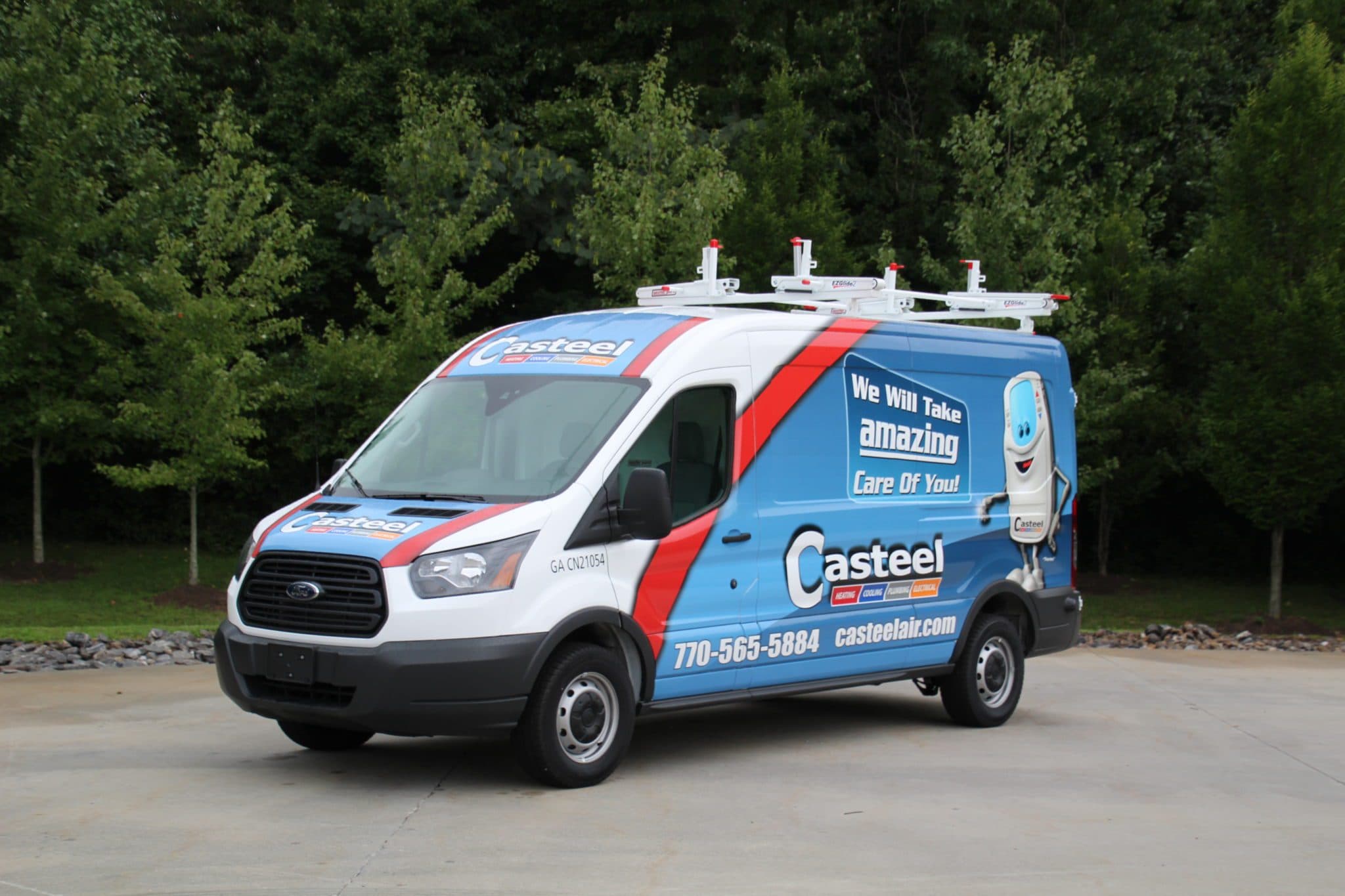 A van wrapped with the Casteel logos and colors