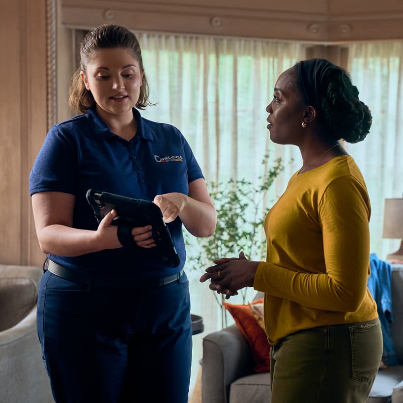 A Casteel Comfort Advisor discuss our Comfort360 Membership benefits with a homeowner.